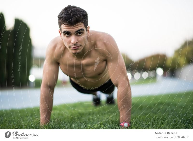 Man training fitness push ups - a Royalty Free Stock Photo from Photocase
