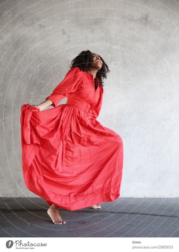 dancing woman in a red dress Feminine Woman Adults 1 Human being Wall (barrier) Wall (building) Dress Barefoot Brunette Long-haired Curl Relaxation To hold on