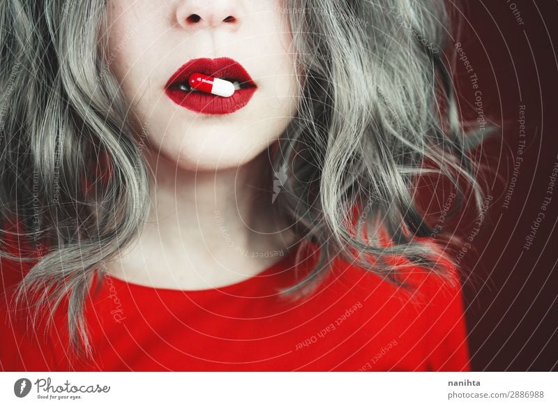Close up of young woman's lips holding a pill Style Design Skin Face Lipstick Health care Medical treatment Intoxicant Medication Human being Feminine