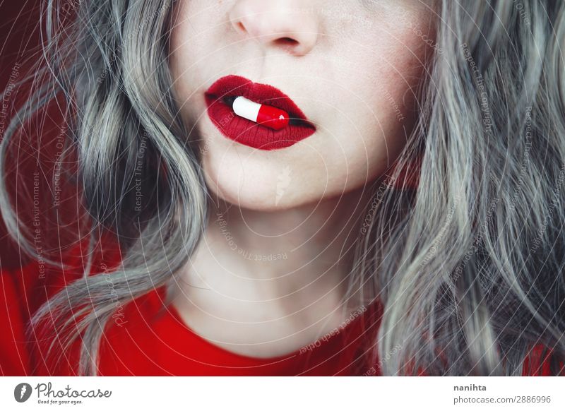 Close up of young woman's lips holding a pill Design Skin Face Lipstick Healthy Health care Medical treatment Intoxicant Medication Human being Feminine