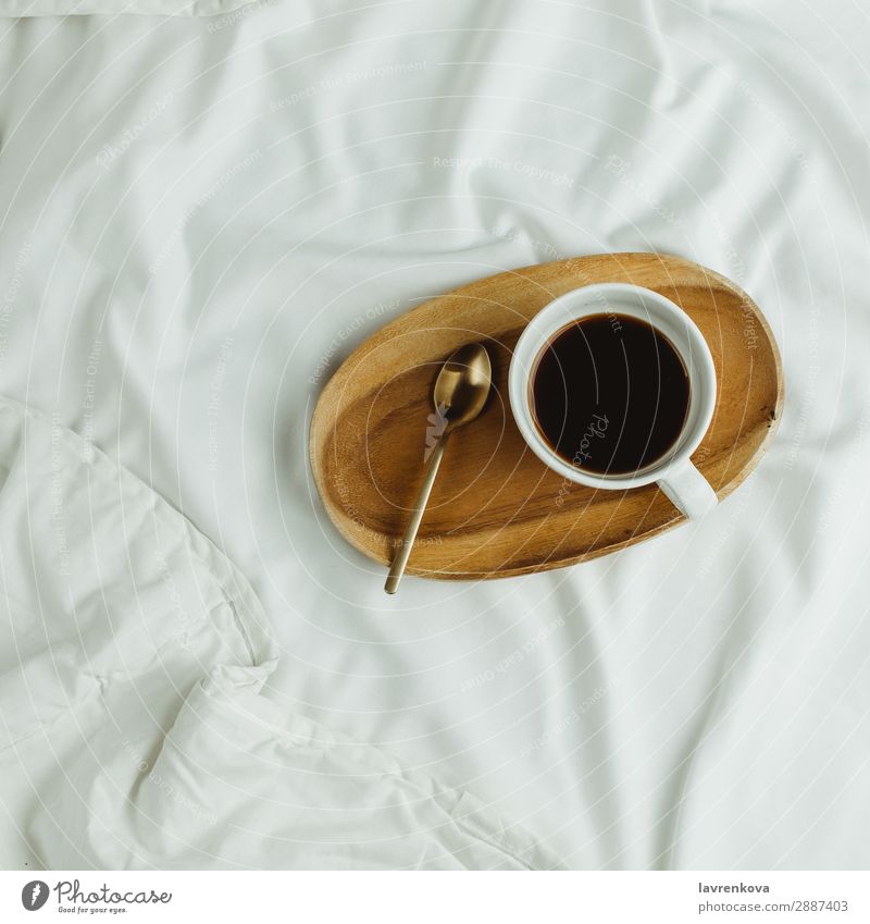 Cup of coffee and spoon on wooden tray in bed on white sheets Background picture Bedroom Beverage Black Breakfast Coffee Drinking Espresso Healthy Eating