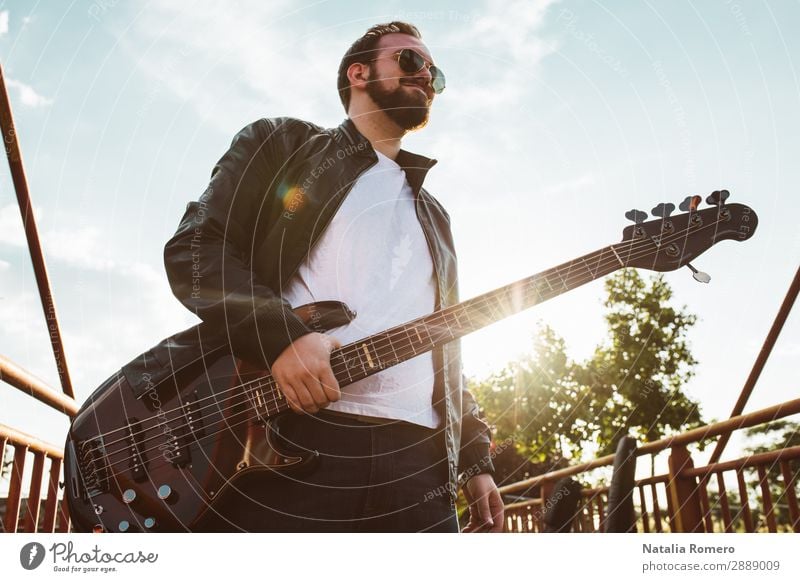 outdoor photo session with a bass player and his instruments Playing Entertainment Music Human being Man Adults Concert Band Musician Guitar Nature Rock Black