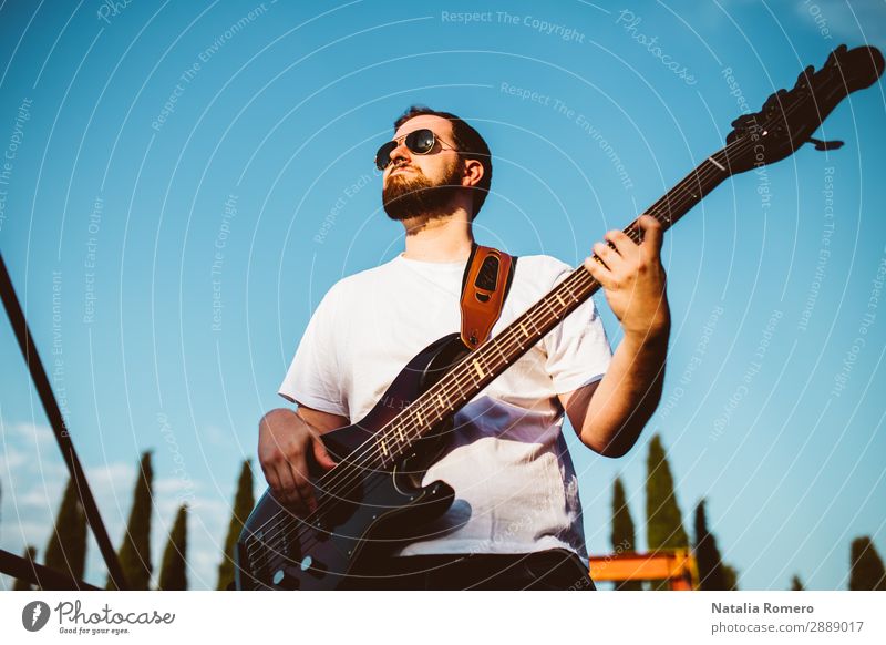 outdoor photo session with a bass player and his instruments Playing Entertainment Music Human being Man Adults Concert Band Musician Guitar Nature Rock Black