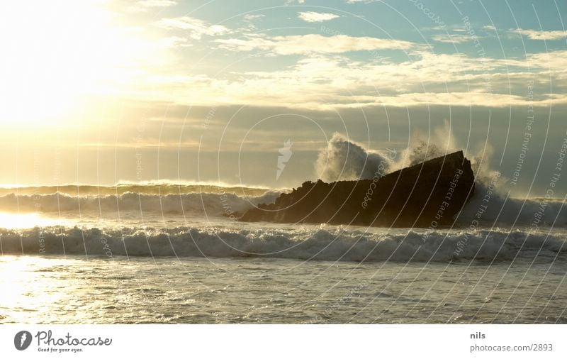 splash Ocean Surf Waves White crest Sunset Evening sun To break (something) Explosion Water Rock Bursting