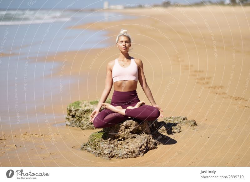 Caucasian blonde woman practicing yoga in the beach Lifestyle Beautiful Body Harmonious Relaxation Calm Meditation Summer Beach Ocean Sports Yoga Human being