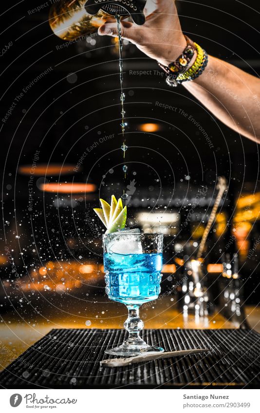 Barman pouring a cocktail into a glass Cocktail shaker martini bartender Glass Portion Boston Beverage Drinking Alcoholic drinks Gin Hand Nightclub Vodka