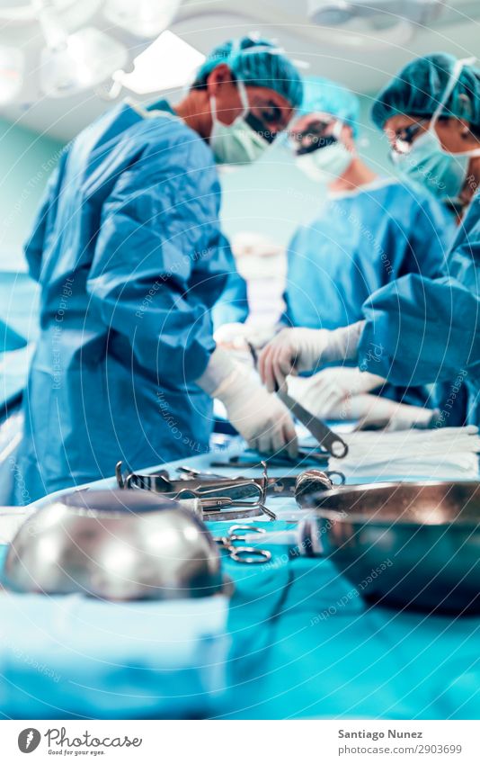 Team of Surgeons Operating. Operation Surgery operating surgical Hospital Room Doctor Theatre Medication Work and employment Group instrumental clinic Man Woman