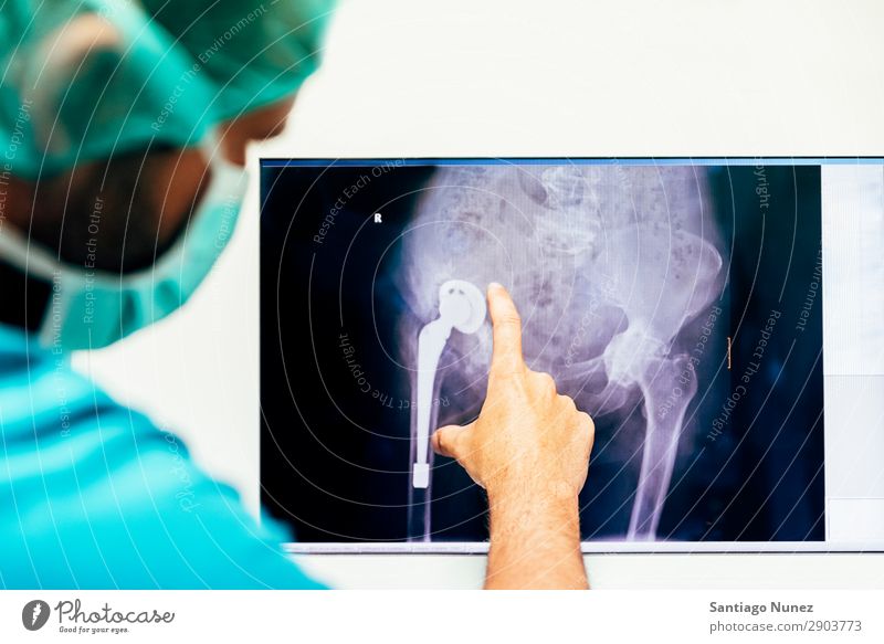 Medicine doctor looking x-ray image. Back backbone Bone Considerate Diagnosis Doctor Examinations and Tests examining Healthy Health care health-care Hospital