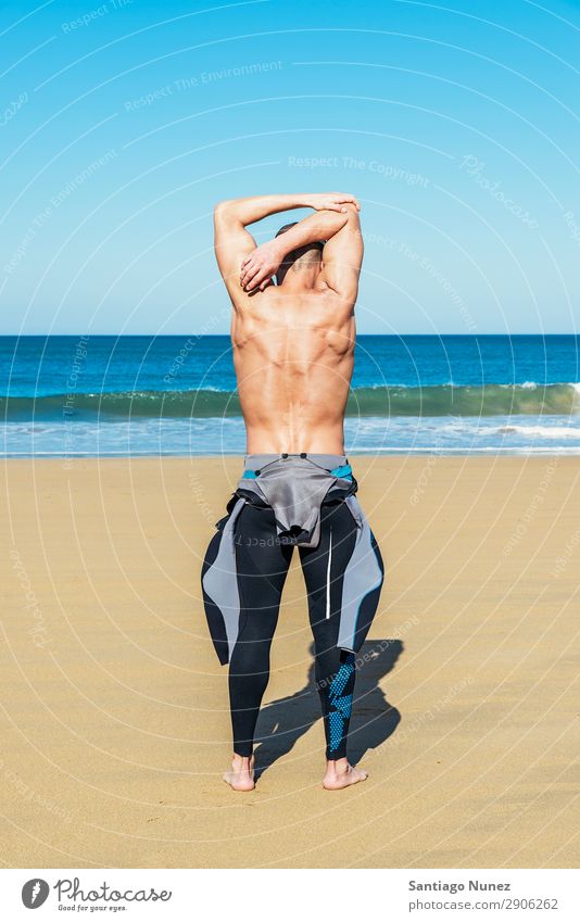 fitness man swimmer training stretching Beach Black Caucasian Diver Practice Athletic Fitness Person wearing glasses Skiing goggles handsome Healthy Lifestyle