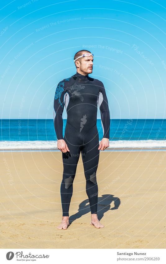 Handsome Swimmer ready to start swimming Beach Black Caucasian Diver Practice Athletic Fitness Person wearing glasses Skiing goggles handsome Happy Healthy