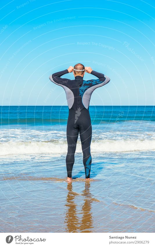 swimmer ready to go swimming in the sea Attractive Beach Black Caucasian Diver Practice Athletic Fitness Person wearing glasses Skiing goggles handsome Healthy