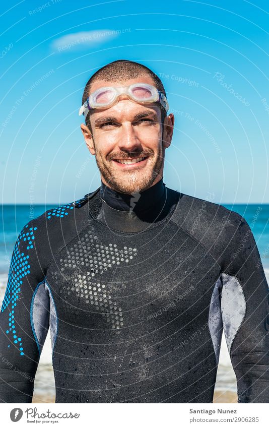 Handsoem Swimmer portrait on the beach Beach Black Caucasian Diver Practice Athletic Fitness Person wearing glasses Skiing goggles handsome Happy Healthy