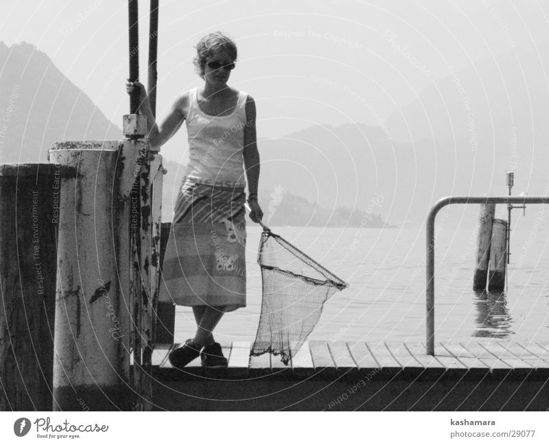 Where's the fish? Fishing (Angle) Human being Feminine Young woman Youth (Young adults) 1 Water Lake Lake Lucerne Switzerland Wait Black White