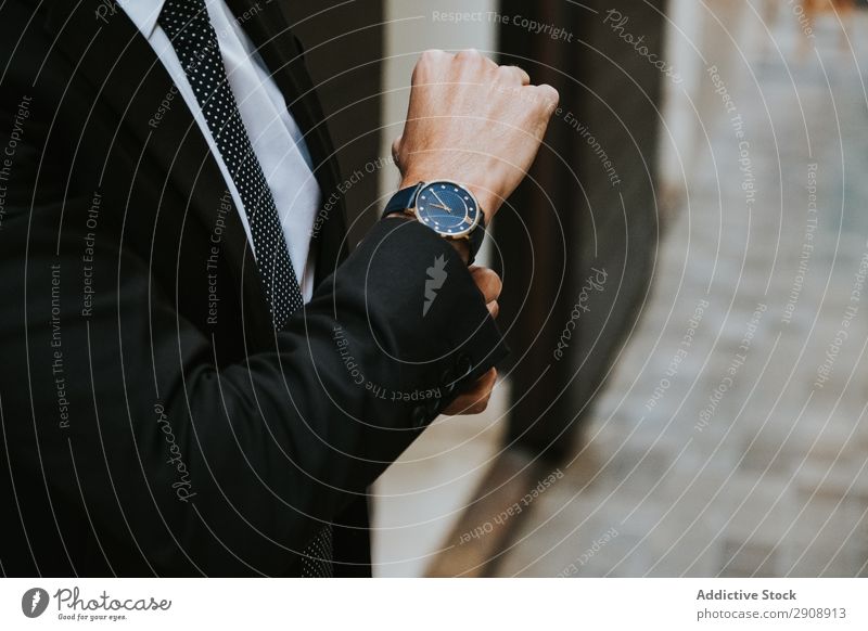 Young stylish man in costume with watch Man Businessman Observe Elegant Indicate Costume Suit Formal Youth (Young adults) Style Time Professional Success boss