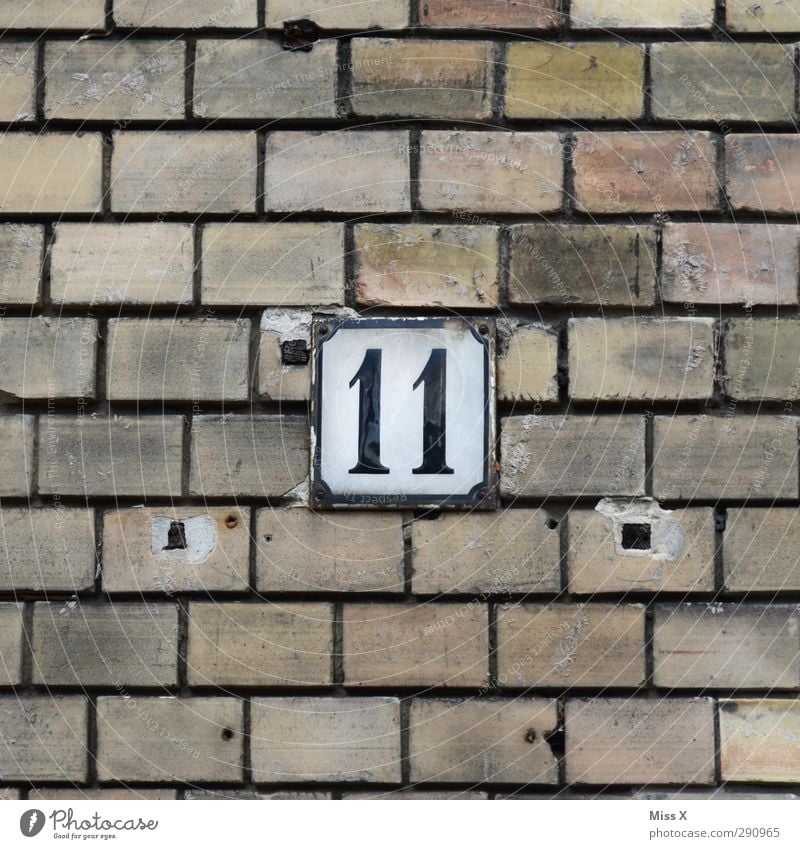 11 Sign Characters Signs and labeling Old House (Residential Structure) Wall (building) Wall (barrier) Brick wall Digits and numbers House number Hollow