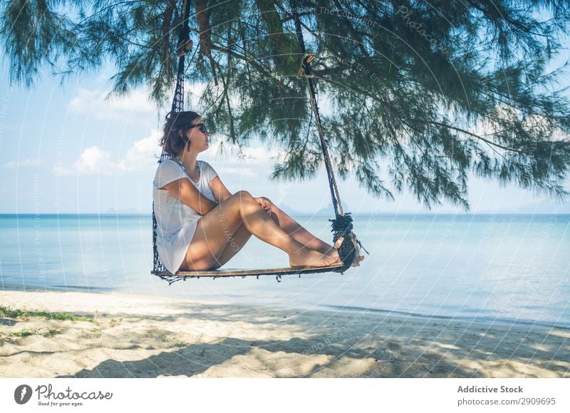 Woman in hammock near sea Hammock Ocean Beach Relaxation Thailand Sunbeam Day Barefoot Vacation & Travel Paradise Summer Rest Lifestyle Leisure and hobbies