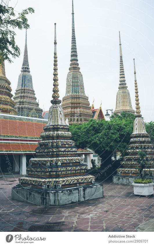 Pyramids in yard of oriental temple Temple Thailand Ornament decor Asia Culture Ancient Tradition Religion and faith Architecture Landmark Building