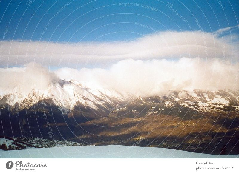 The mountain calls_2 Mountain range Switzerland Winter Cold Clouds Formulated Alps Snow Vantage point Tall Blue sky clear vision