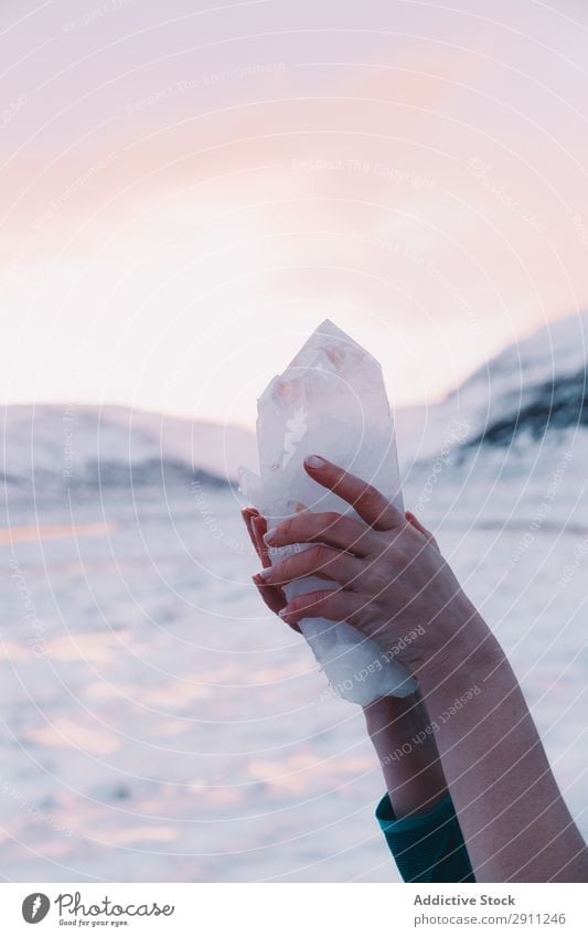 Woman holding amazing stone near hills Crystal Stone Hill Amazing Rock Hand Sky Pink Mountain Nature Vacation & Travel Landscape Adventure Hiking Tourism