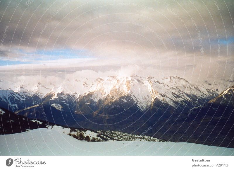The mountain calls_3 Mountain range Switzerland Winter Cold Clouds Formulated Alps Snow Vantage point Tall Blue sky clear vision