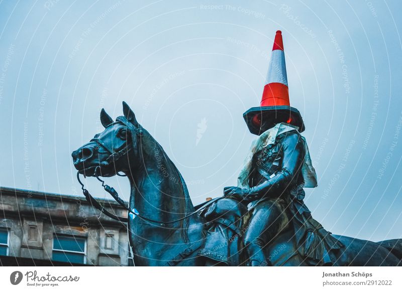 Rider statue with cone of guidance on the head Construction site Art Fog Hat Road sign Cold Funny Point Blue Red Glasgow Great Britain Scotland Blind