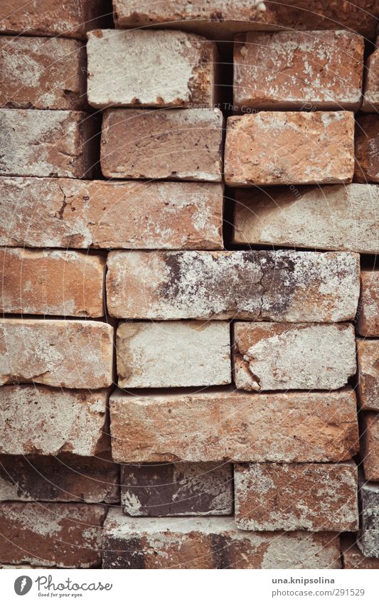 builds again on II Manmade structures Wall (barrier) Wall (building) Stone Brick Dirty Sharp-edged Stack Tidy up Build Construction site Material Colour photo