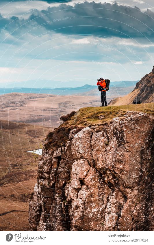 A photographer takes a picture of the view on Isle of Skye II Nature Environment Hiking Vacation & Travel Mountain Sea coast hike hiking trail Quiraing