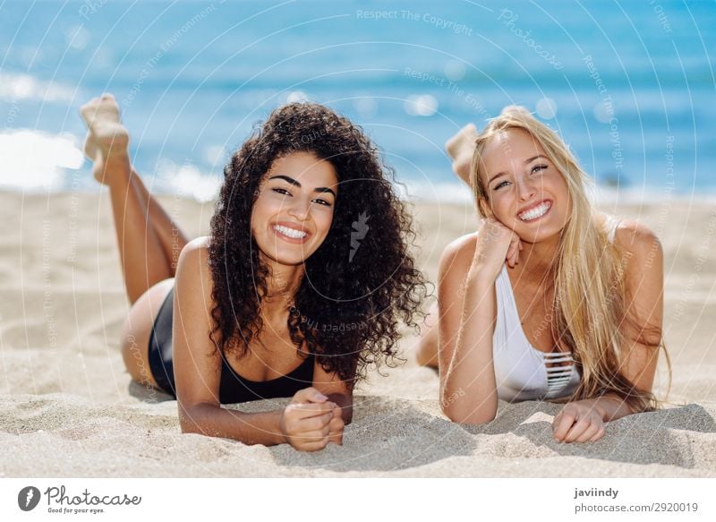 Two young women in swimsuit on a tropical beach Lifestyle Joy Happy Beautiful Body Hair and hairstyles Leisure and hobbies Vacation & Travel Tourism Summer