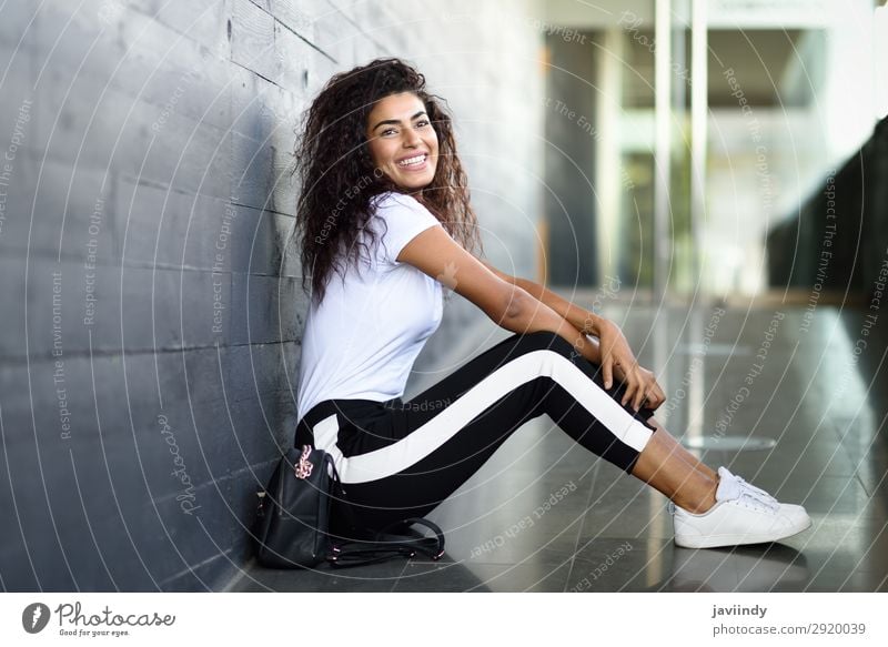 Beautiful girl in black leggings and a t-shirt, happy face, long hair, a  smile on his face, dancing Stock Photo by ©VladimirDrozdin 59724665