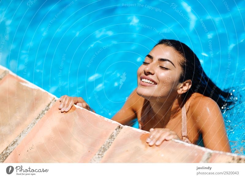 Beautiful Arab woman relaxing in swimming pool. Lifestyle Happy Body Hair and hairstyles Skin Relaxation Swimming pool Leisure and hobbies Vacation & Travel