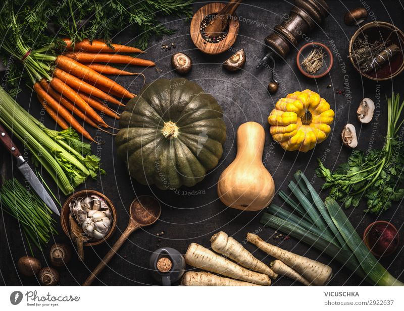 Autumn seasonal food. Colorful various pumpkins and organic farm vegetables. Vegetarian cooking. Thanksgiving or Halloween recipes. autumn colorful dark kitchen