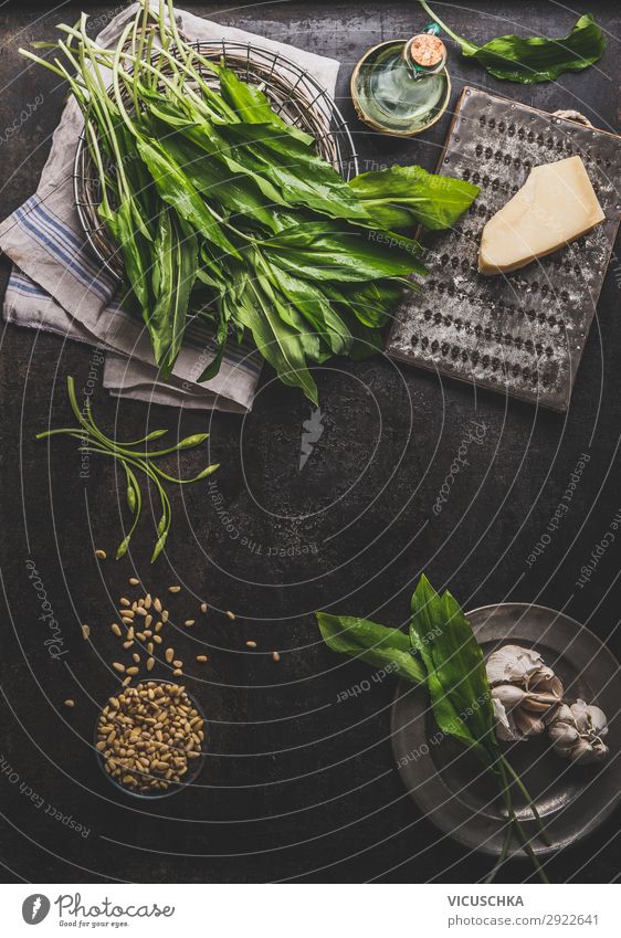 Wild garlic pesto ingredients on dark rustic kitchen table Food Herbs and spices Nutrition Organic produce Vegetarian diet Diet Crockery Style Healthy Eating