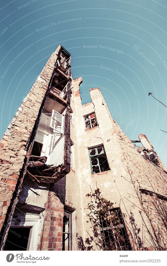 Old houses down to the ground. Environment Sky Ruin Building Architecture Facade Window Stone Exceptional Historic Tall Broken Blue Decline Transience Change