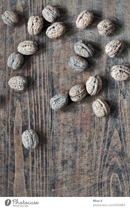 Nuts on the table Food Nutrition Healthy Delicious Walnut Nutshell Table Wood Wooden table Hard Colour photo Subdued colour Close-up Structures and shapes
