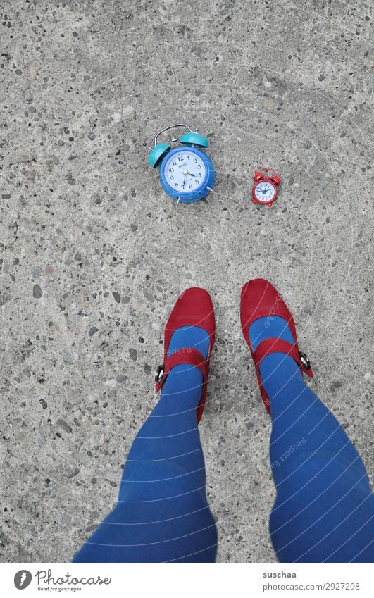 red and blue time Woman Legs Feet High heels Red Blue Street Asphalt Exterior shot Alarm clock Clock Time Haste timing instrument Morning Midday Evening