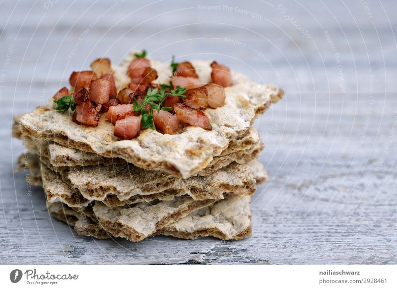 Crispbread with bacon cubes key words Food grain Dough Baked goods Herbs and spices Bread Bacon cube Nutrition Breakfast Lunch Wooden table Healthy Eating