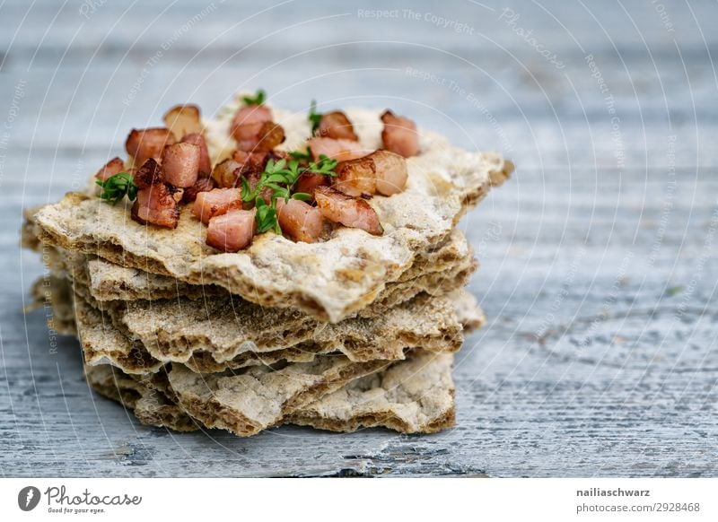 Crispbread with bacon Food Grain Dough Baked goods Bread Herbs and spices Bacon Bacon cube Nutrition Breakfast Lunch Lifestyle Healthy Eating Wooden table