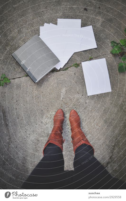 woman is standing on the street in front of a fallen file order with falling leaves Legs Woman Stand Boots feminine File Work and employment streetwork