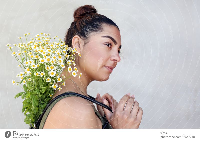 Woman with flowers Feminine Adults 1 Human being Flower Bouquet Chamomile Wall (barrier) Wall (building) T-shirt Backpack Brunette Long-haired Chignon Observe