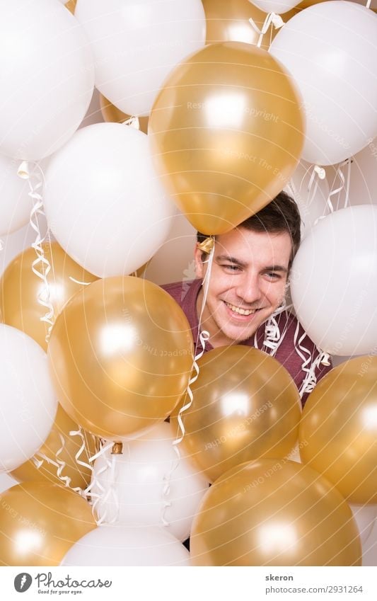 smiling boy hiding in the balloons Lifestyle Leisure and hobbies Playing Feasts & Celebrations Birthday Work and employment Profession Career Success
