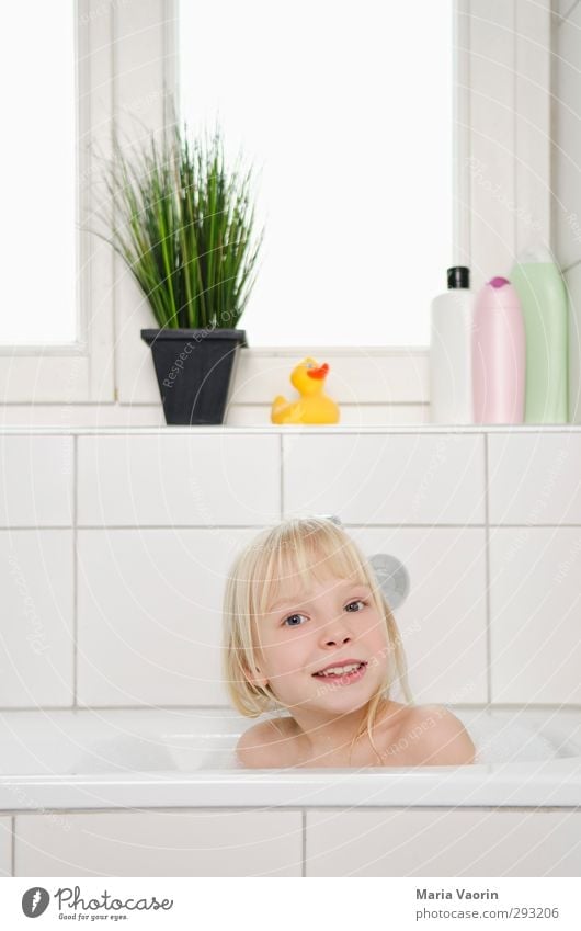 Two kids taking a bath looking a camera - a Royalty Free Stock Photo from  Photocase