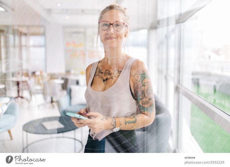 portrait of tattooed business woman Happy Beautiful Reading Work and employment Office Business Company Meeting Telephone PDA Technology Human being Woman
