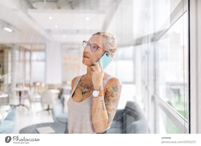 young business woman making call with smartphone Style Beautiful Work and employment Office Business Telephone PDA Technology Human being Woman Adults Tattoo