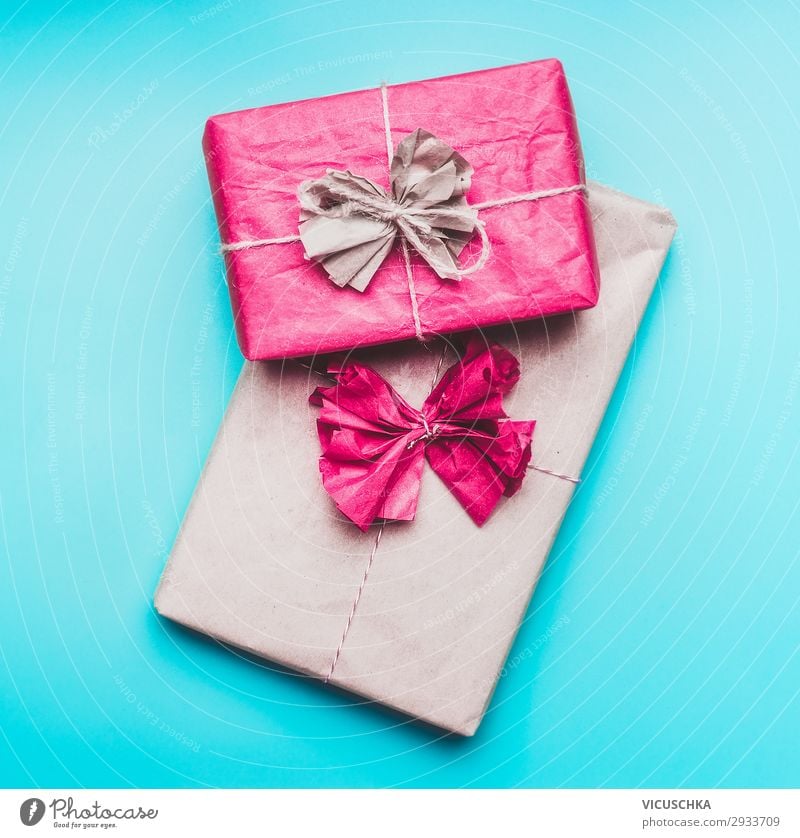 Gifts on blue background Design Joy Event Feasts & Celebrations Paper Packaging Decoration Hip & trendy Blue Pink greeting present wrapping Background picture