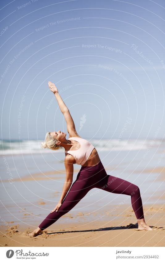 Caucasian blonde woman practicing yoga in the beach Lifestyle Beautiful Body Harmonious Relaxation Meditation Summer Beach Ocean Sports Yoga Human being