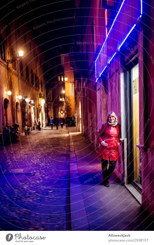 young woman at night in the neon light of the city center of Rome Europe Italy Town City Vacation & Travel Travel photography Blue sky Clouds Young woman Red