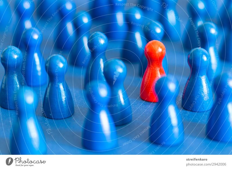 Single red figure between many blue figures on blue background Playing Board game Group Toys Wood Sign Select Together Uniqueness Rebellious Blue Red