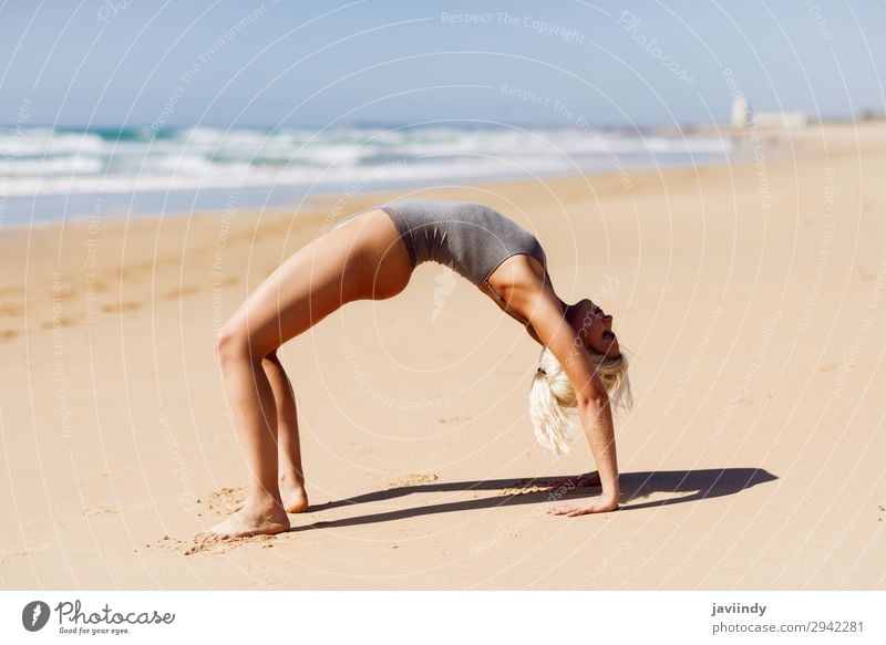 Meditation By Sex Young Women In White Dress On A Bridge By The Sea. Pretty  Woman Doing Yoga On The Beach. Sporty Woman Sitting In Yoga Position At Sea  View Background. Stock