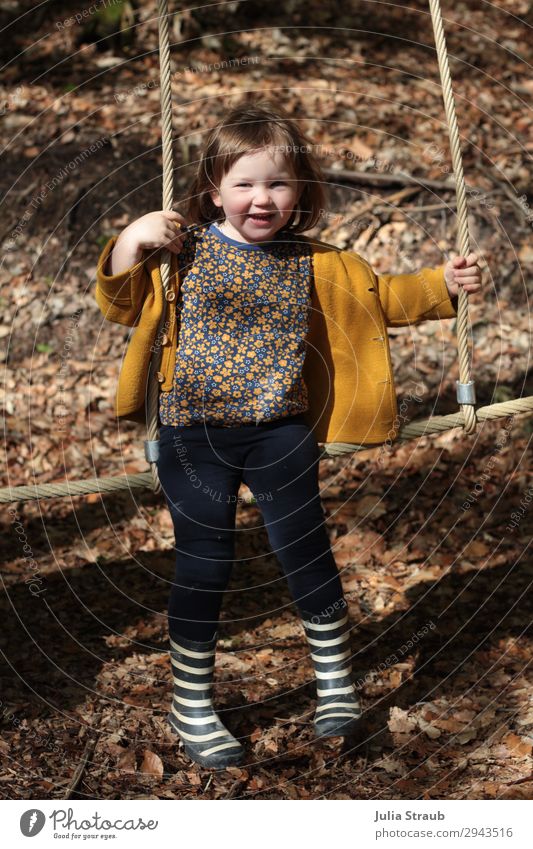 girls climbing frame forest playground Feminine Toddler Girl 1 Human being 1 - 3 years Wool jacket Rubber boots Stripe Brunette Short-haired Bangs Hang Laughter