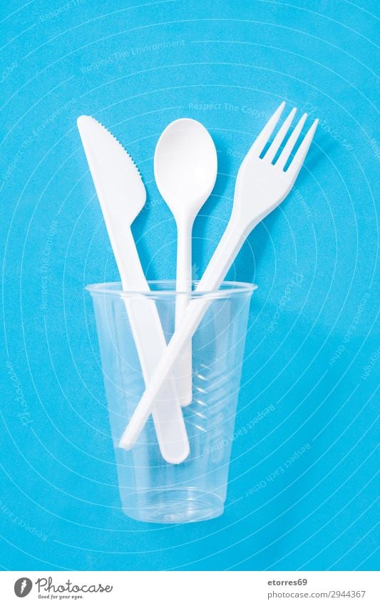 Disposable plastic cutlery on blue background. Top view Kitchen Plastic tableware Cutlery Crockery Recycling empty Environment Fork garbage Group Industrial